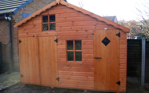 Large wooden childrens playhouse