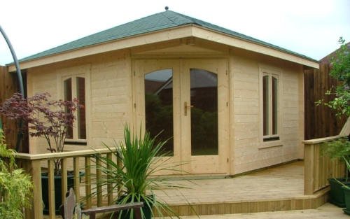 large timber summerhouse with decking
