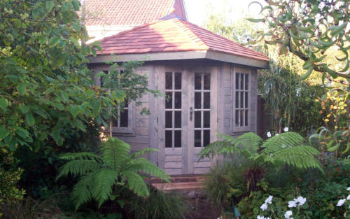 Timber summerhouse with French doors